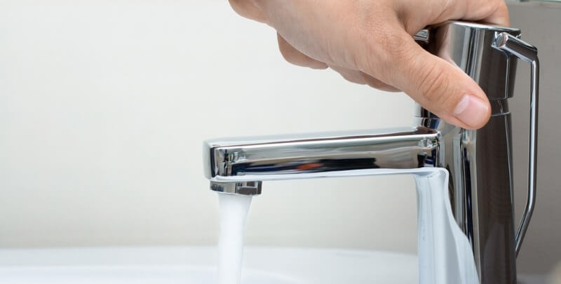 man hand on water tap