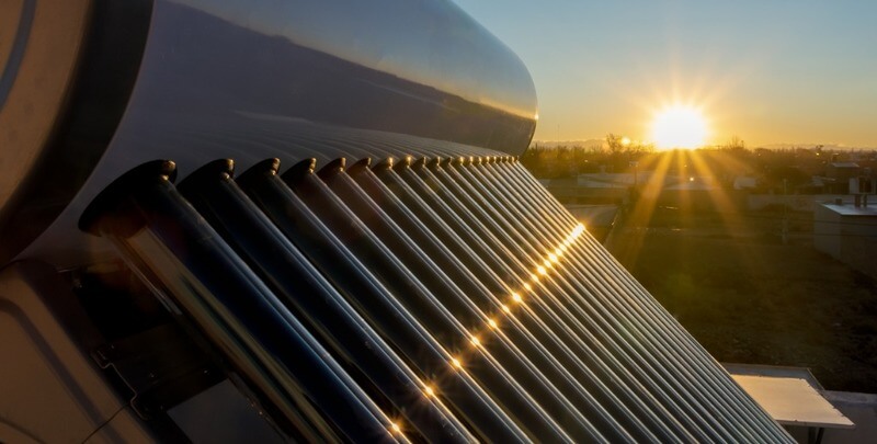 Solar hot water tank at sunset